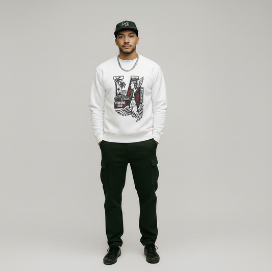 Man wearing a white sweatshirt with a graphic design, black pants, and a black cap on a gray background
