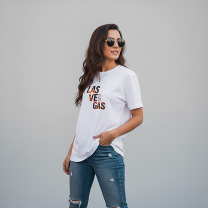 Woman wearing a white t-shirt with 'Las Vegas' text and blue jeans on a gray background