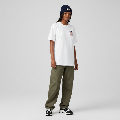 Person wearing a white t-shirt, green pants, and a blue beanie on a gray background