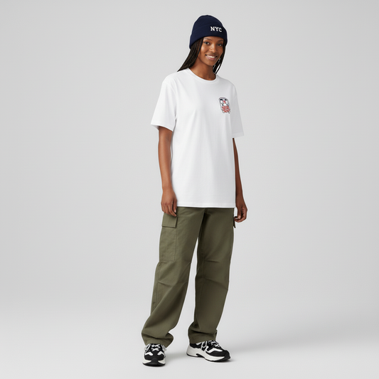 Person wearing a white t-shirt, green pants, and a blue beanie on a gray background